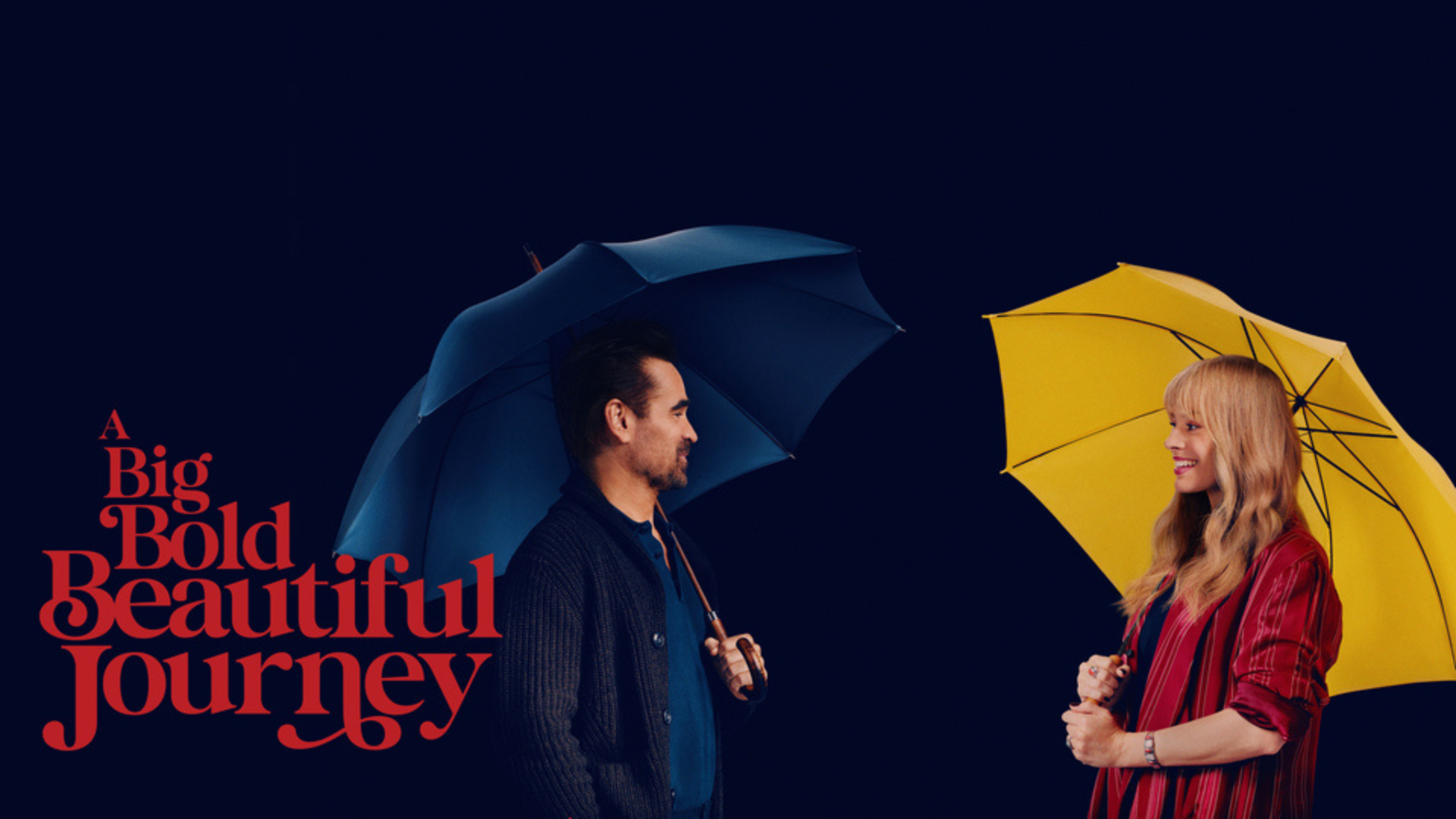 Photo of a man under a blue umbrella and a woman under a yellow umbrella