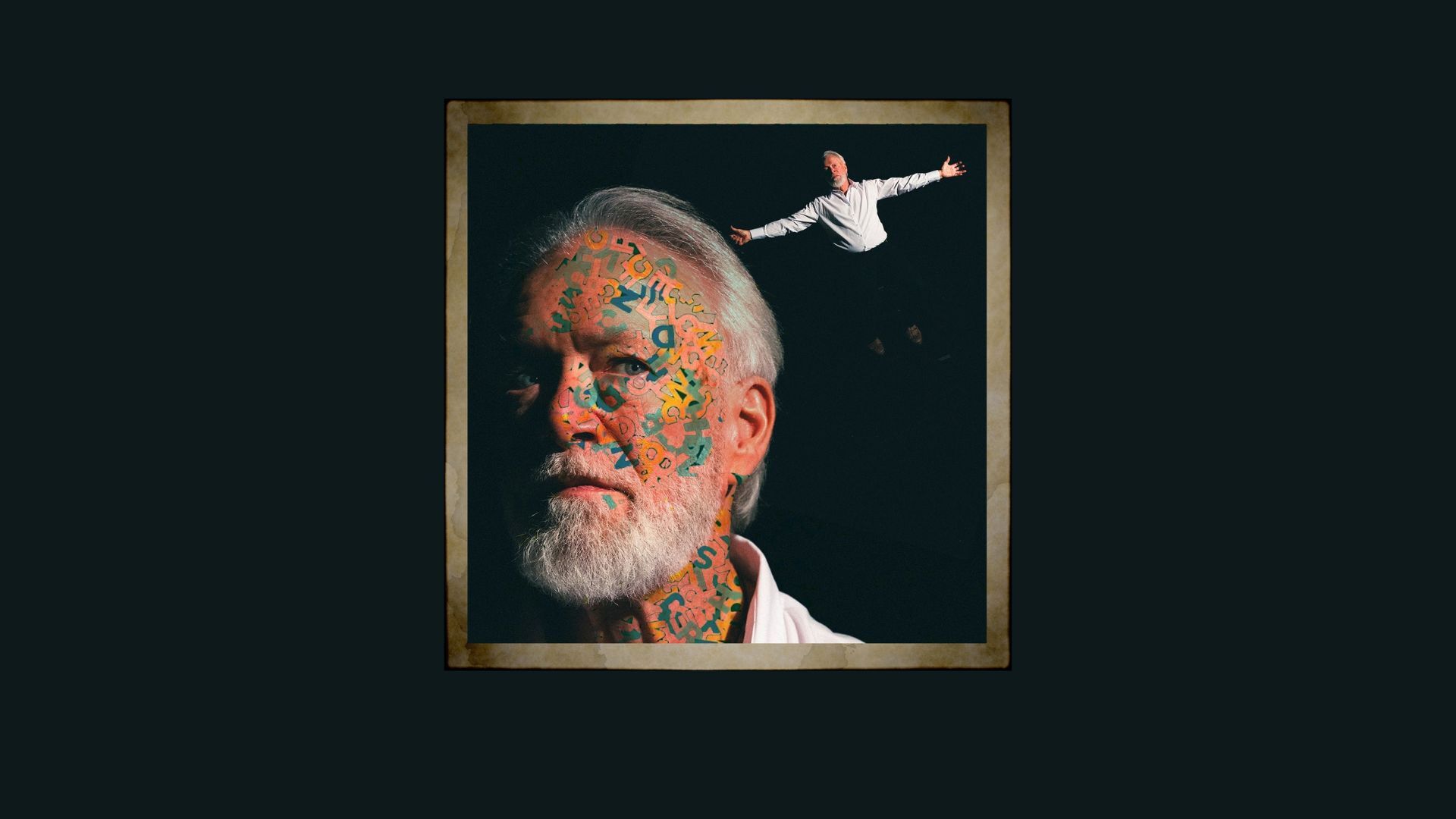 Close of a man with white hair and a beard with writing on his face