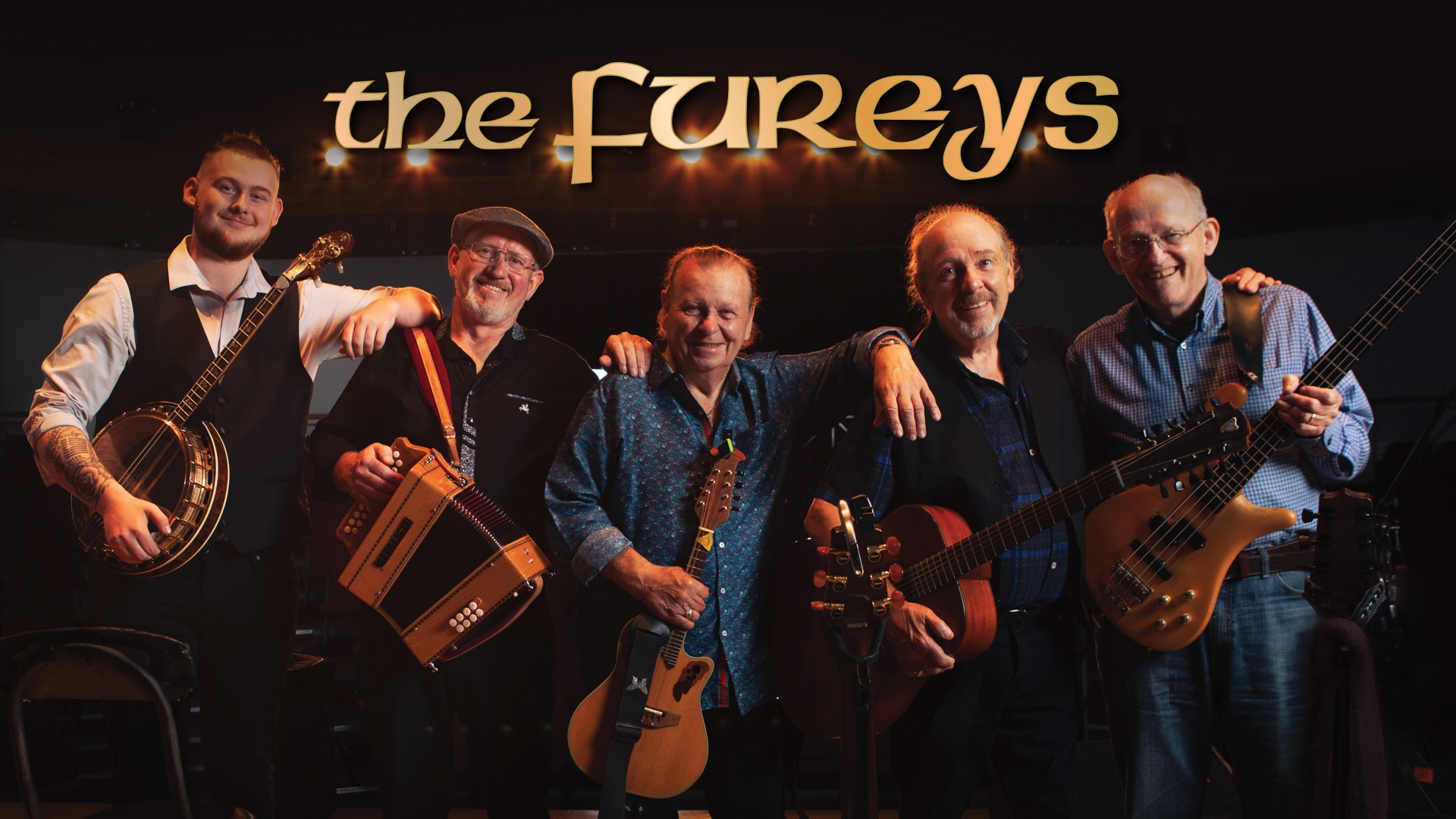 The band smiling and holding their instruments with 'the Fureys' title above them