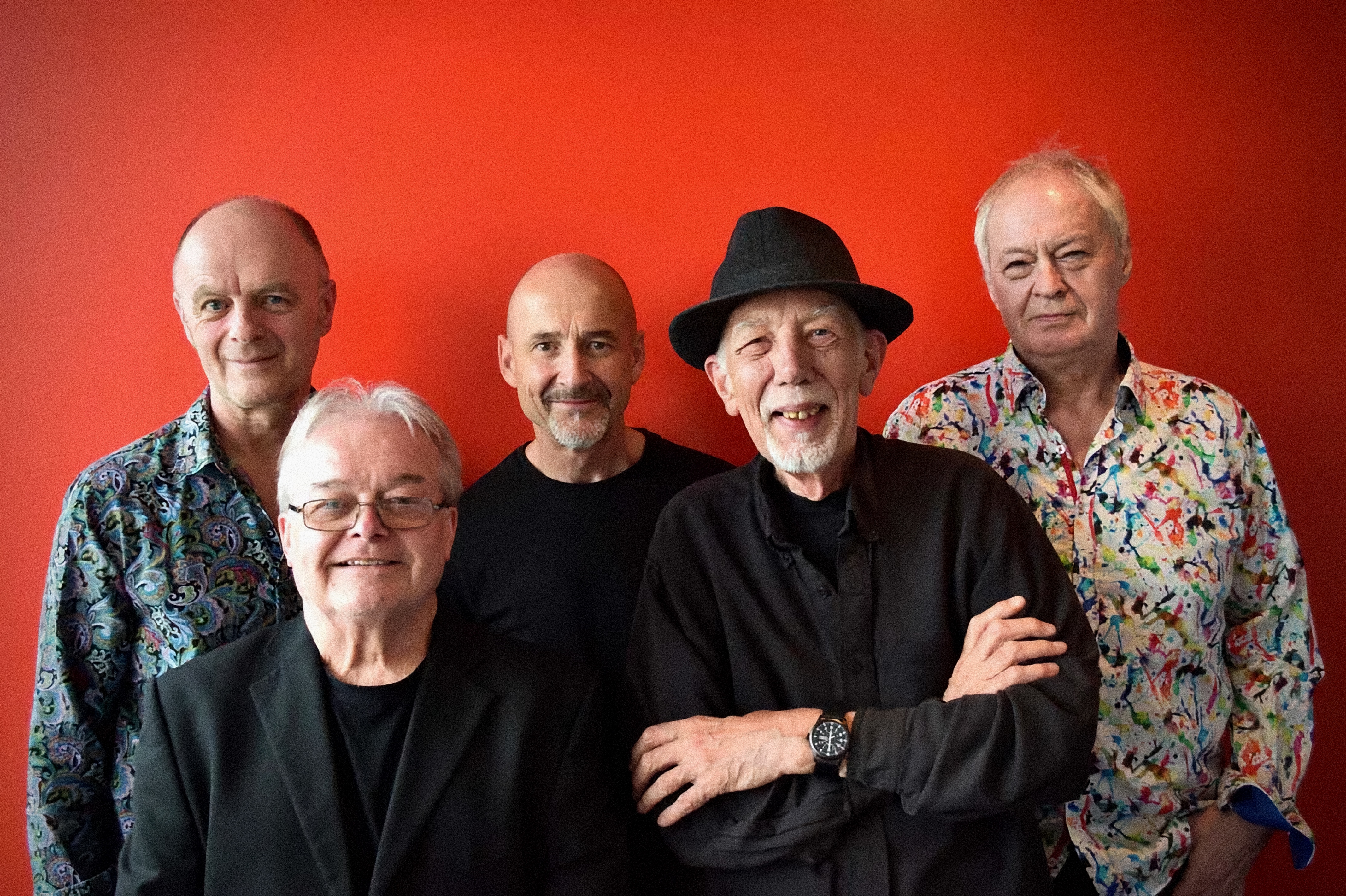 Image of the band against a red background