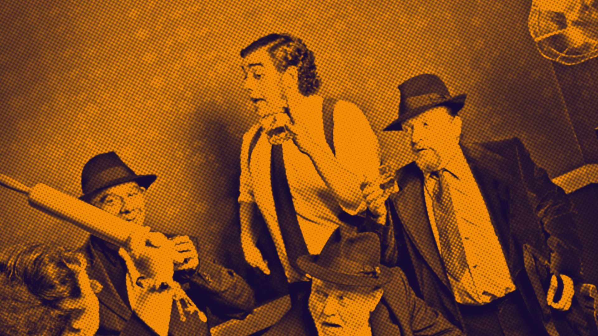 Men in suits talking and one holding a rolling pin up
