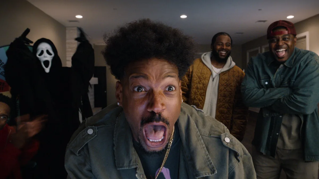 man screaming and others laughing behind him