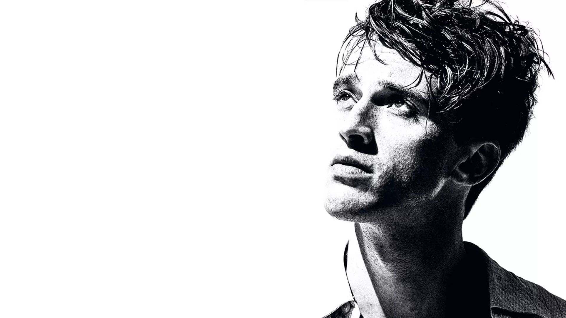 Black and white image of a young man looking