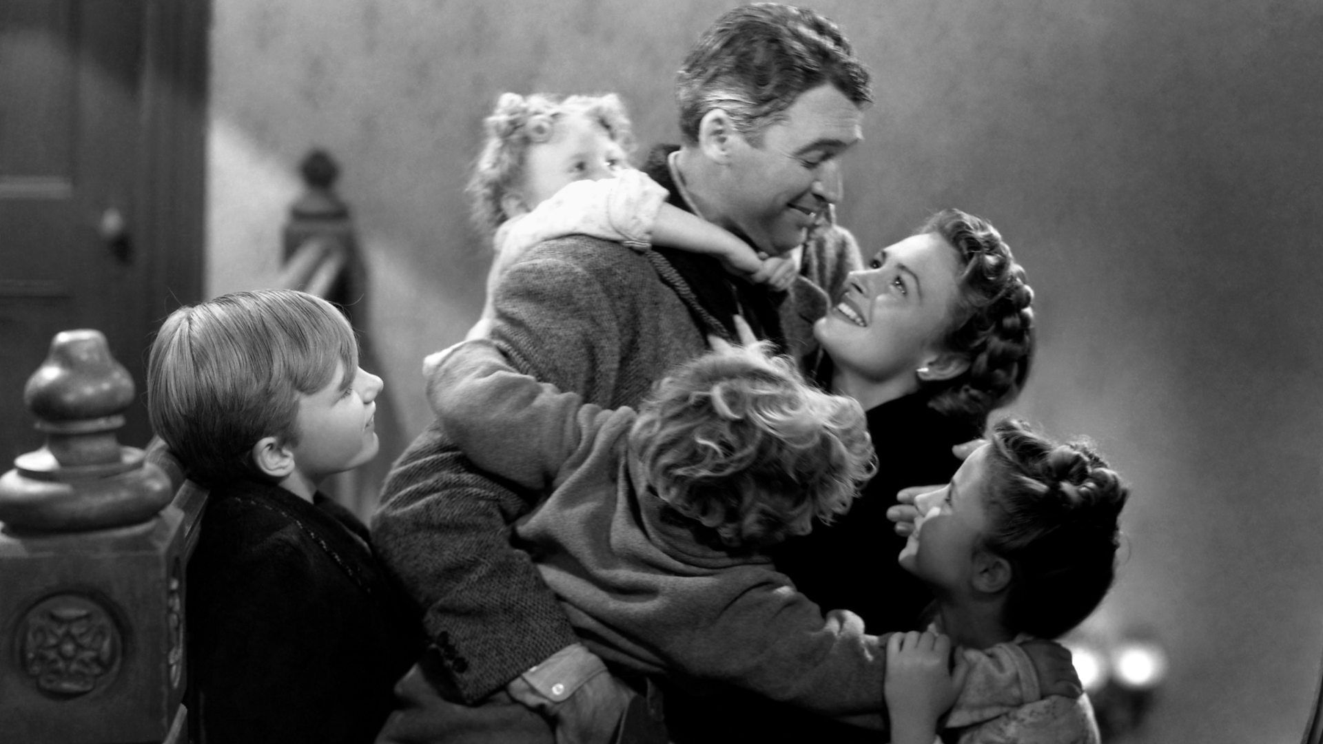 George Bailey hugging his wife and children