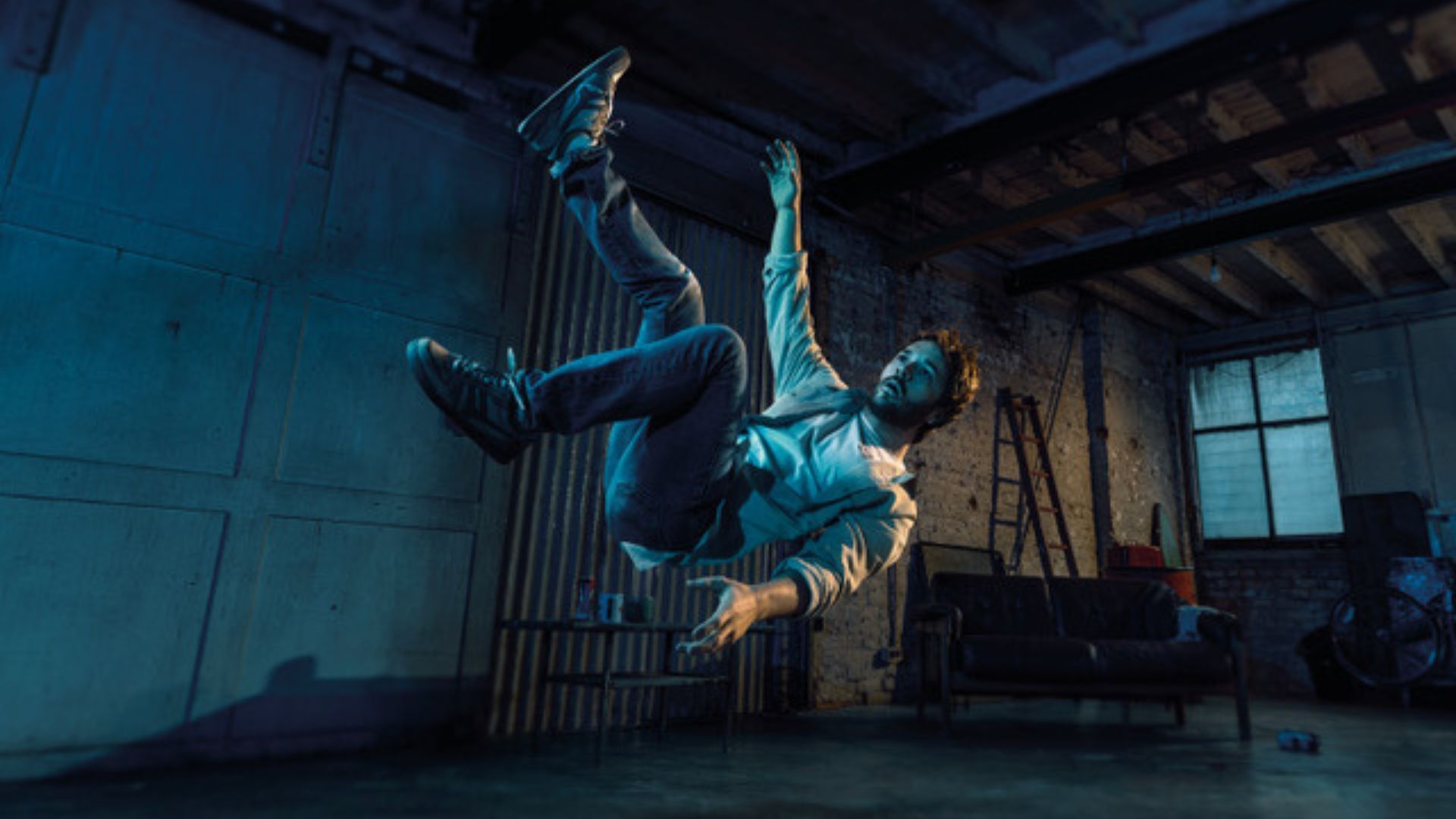 Man falling through the air in a shed