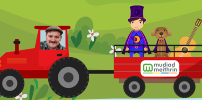 Photo of Welsh Whisperer and Dewin and Doti in a red tractor and trailer