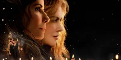 Close up of two woman with black background and candles