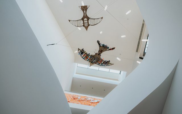 Two hanging wooden art piece, in the shape of birds