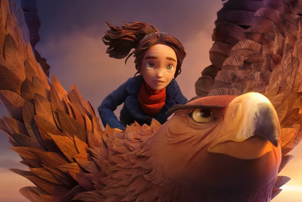 A young girl riding an eagle